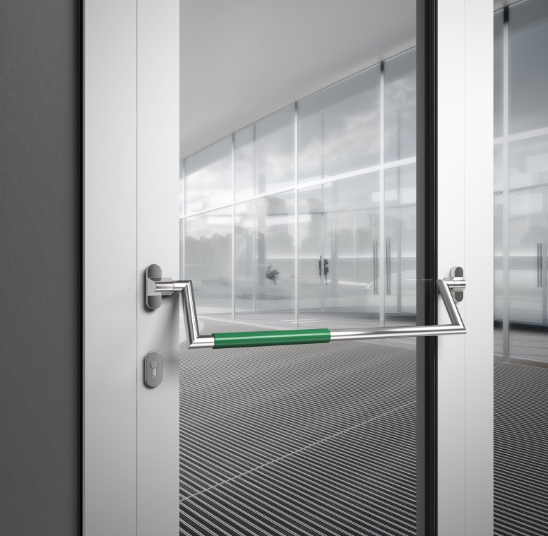 HEWI panic bar stainless steel matt Panic bar on a public building door made of matt polished stainless steel with green polyamide handle tube