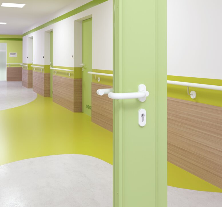 HEWI Signal white door handle Glazed hospital door with green frame equipped with a door handle in the colour signal white made of polyamide
