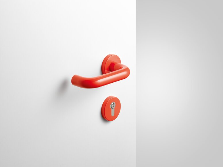 HEWI lever handle coral Lever handle with key rosette in the colour coral made of polyamide