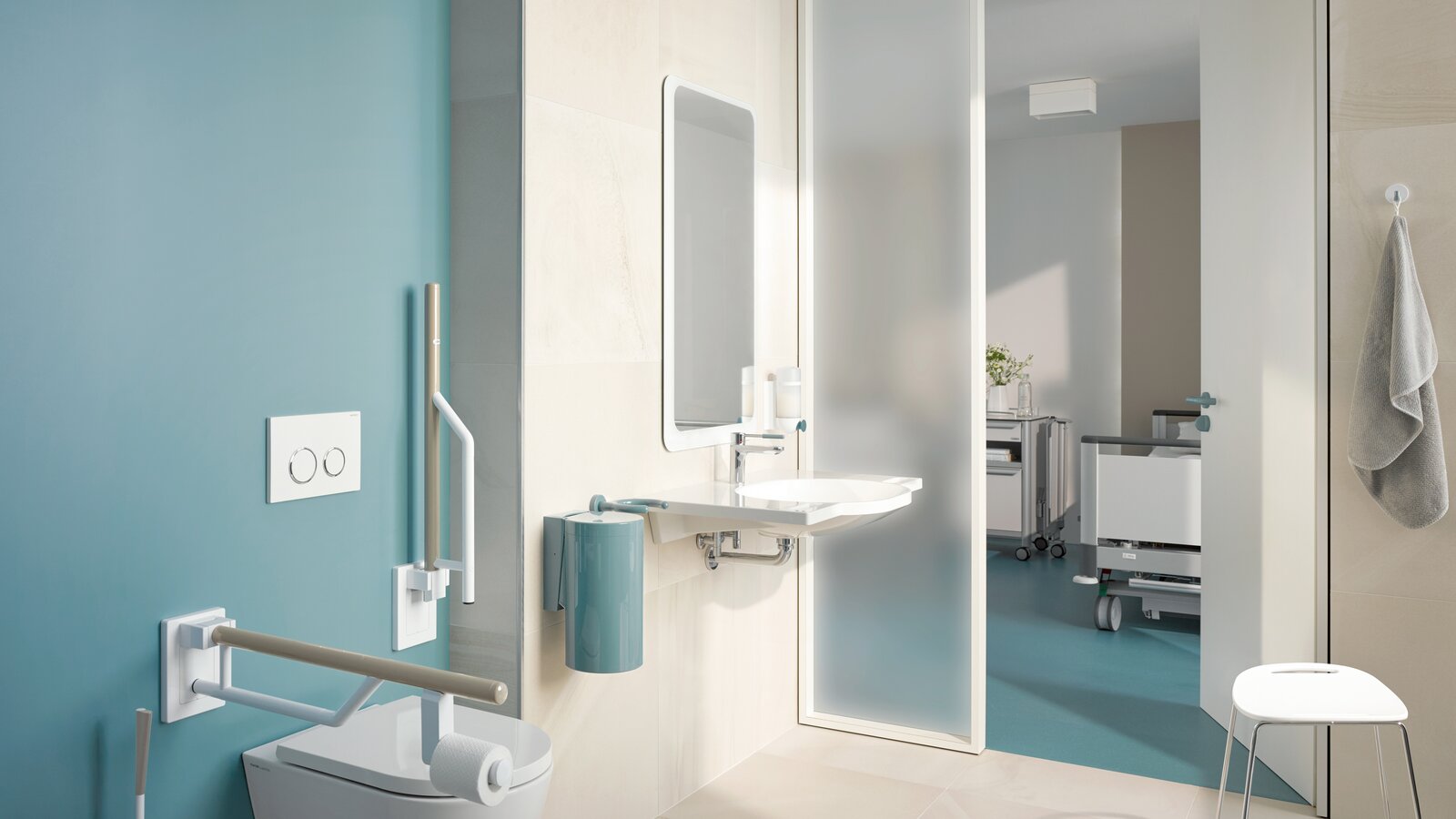 HEWI Series 800K Barrier-free patient bathroom equipped with white and blue sanitary accessories